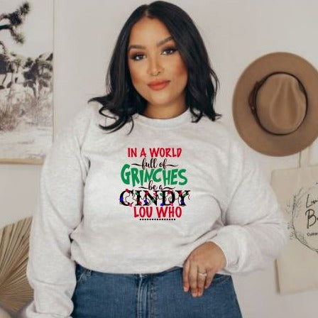 In a world full of Grinches be a Cindy Lou Who Christmas Sweatshirt